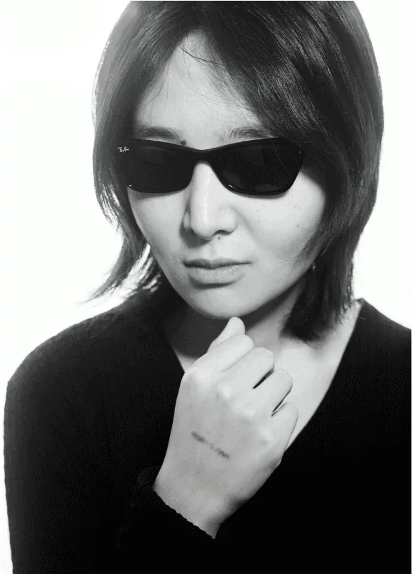 Dorothea Sing Zhang, Young Guns Studio class of 2017, black-and-white portrait in sunglasses